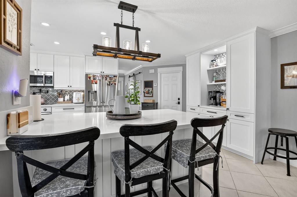 11611 Southwest 52nd Street Cooper City, FL 33330 - Photo 17 of 45 a view of a dining room with furniture