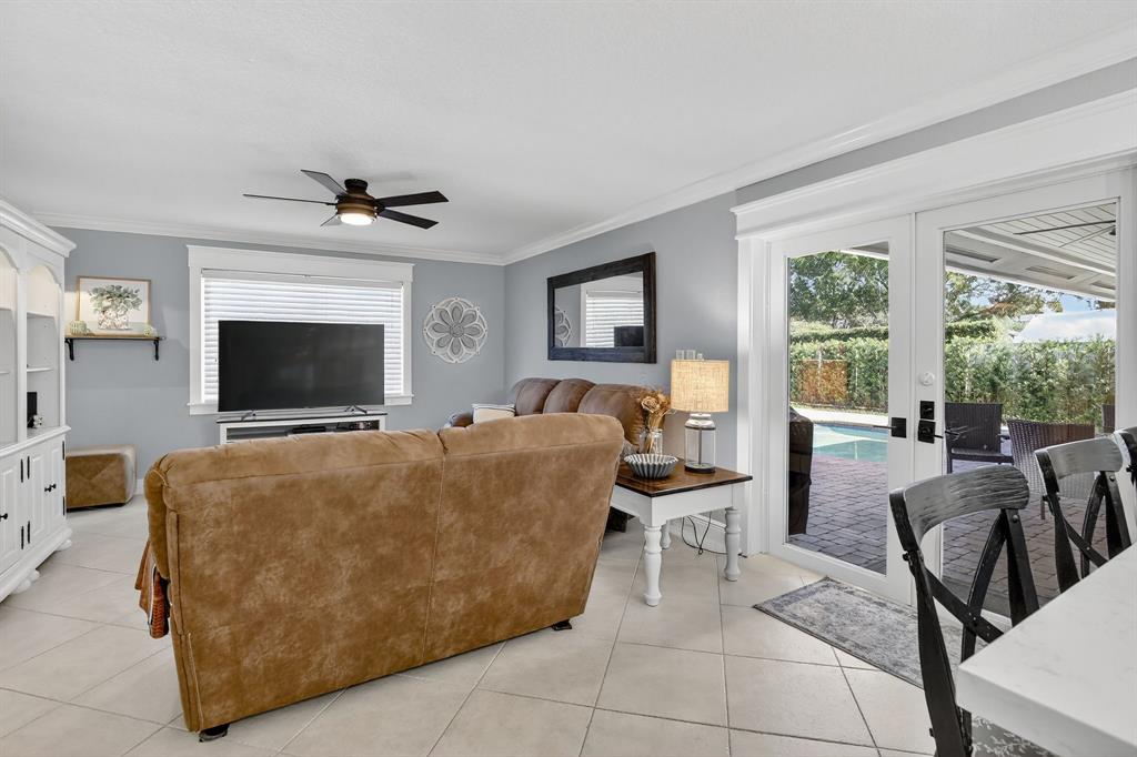 11611 Southwest 52nd Street Cooper City, FL 33330 - Photo 22 of 45 a living room with furniture and a flat screen tv