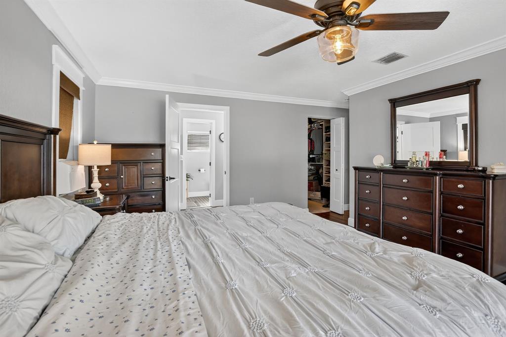 11611 Southwest 52nd Street Cooper City, FL 33330 - Photo 25 of 45 a bedroom with a bed and a dresser