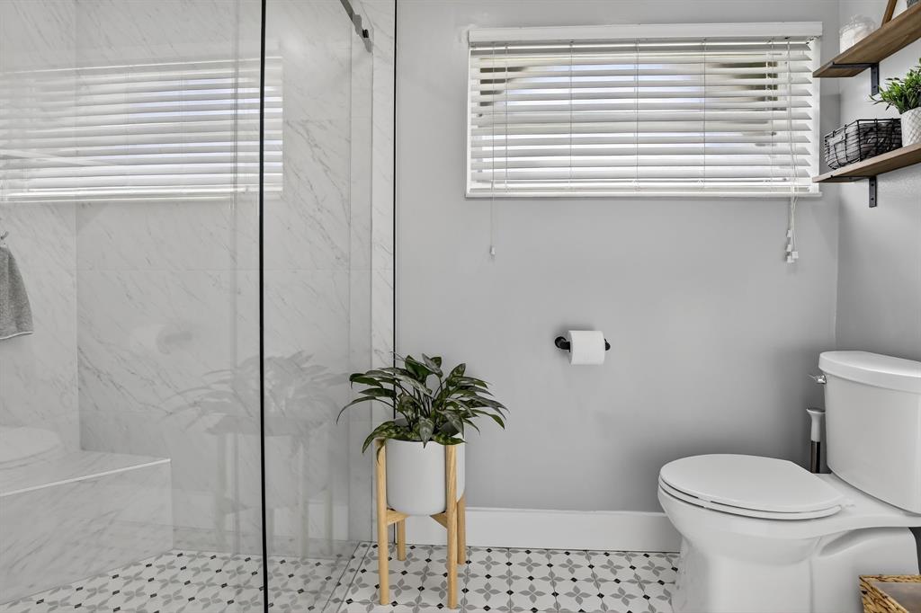 11611 Southwest 52nd Street Cooper City, FL 33330 - Photo 29 of 45 a bathroom with a toilet a sink and a window