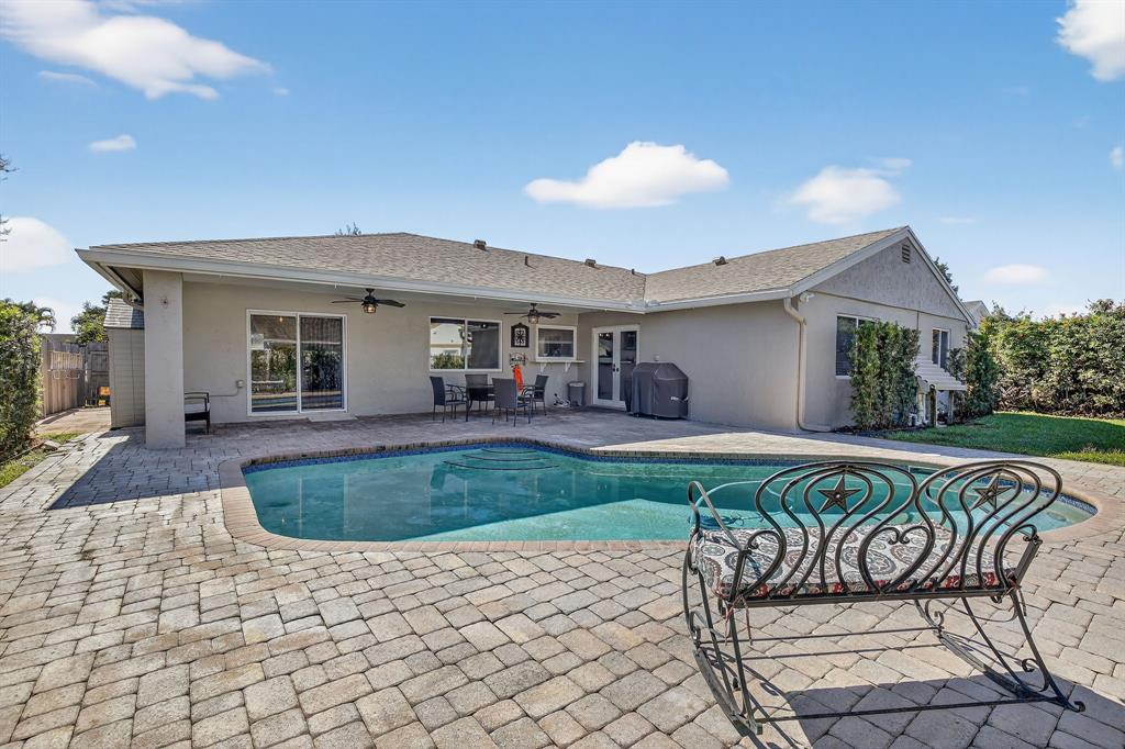 11611 Southwest 52nd Street Cooper City, FL 33330 - Photo 40 of 45 a view of a patio with table and chairs with wooden floor and fence