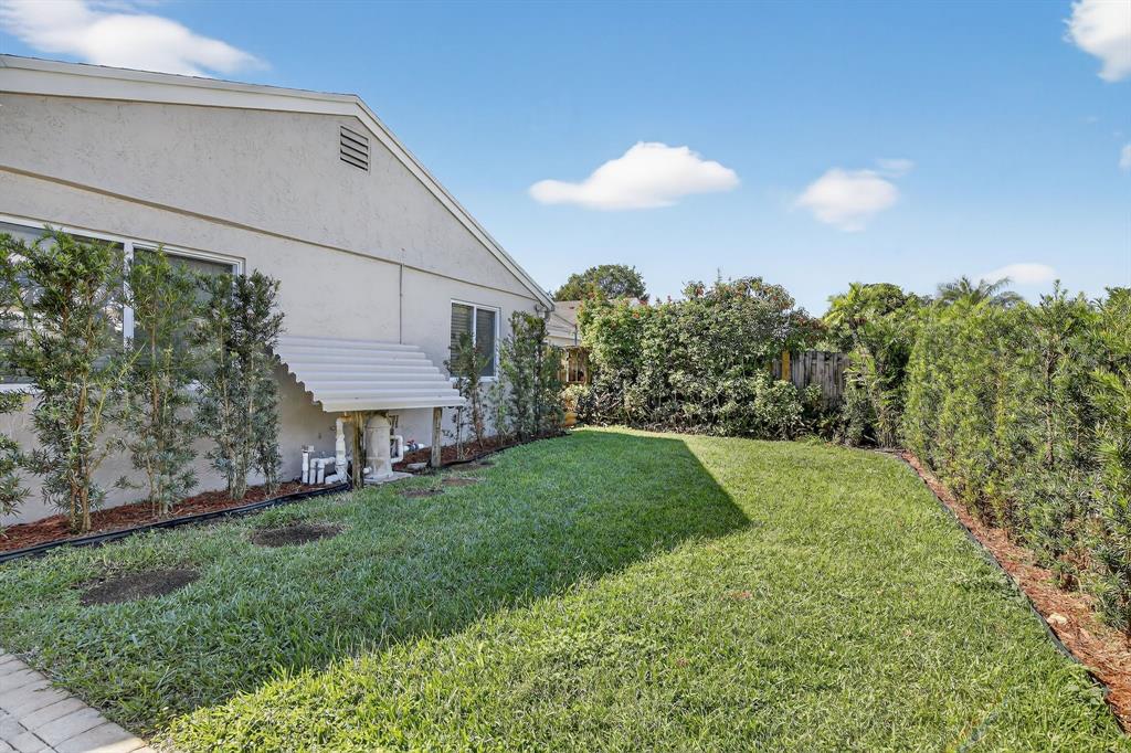 11611 Southwest 52nd Street Cooper City, FL 33330 - Photo 41 of 45 a view of a house with a backyard and a patio