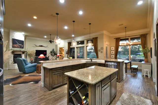 a large kitchen with a table and chairs in it