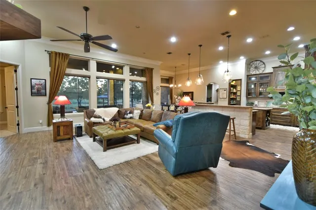 a living room with furniture and a large window