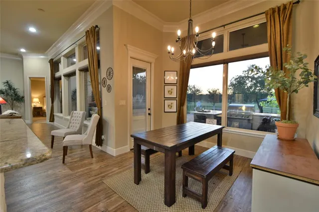 a bed room with a bed and a chandelier