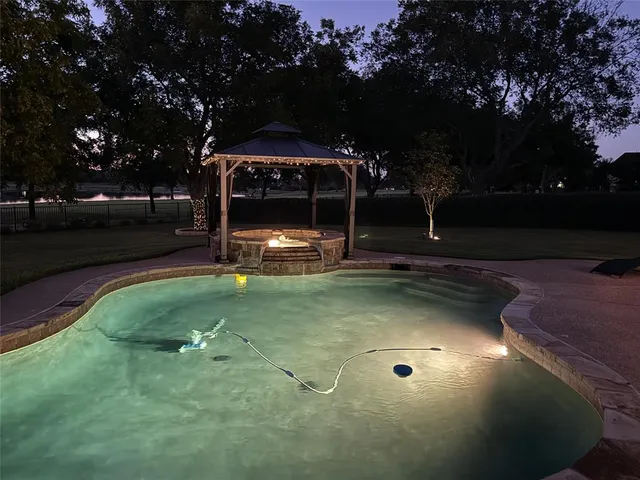 a view of outdoor space with garden and trees