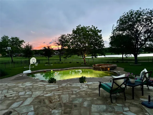 a view of a park with large trees