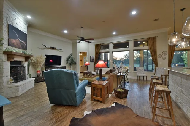 a living room with fireplace furniture and a flat screen tv