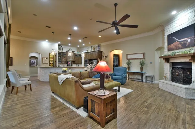 a living room with fireplace furniture and a flat screen tv