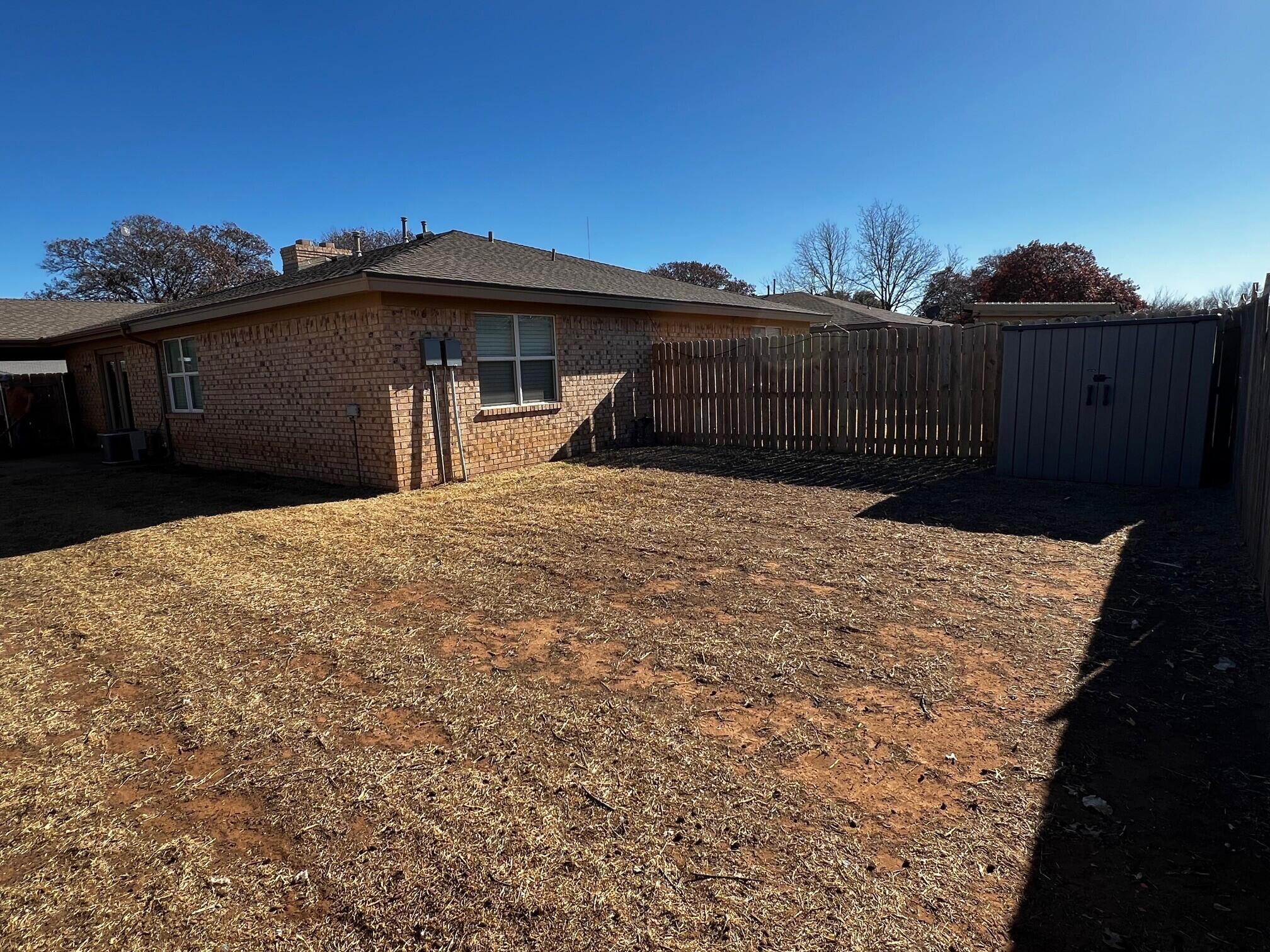 7504 Avenue West, Unit A Lubbock, TX 79423 - Photo 17 of 17 a view of a house with a yard