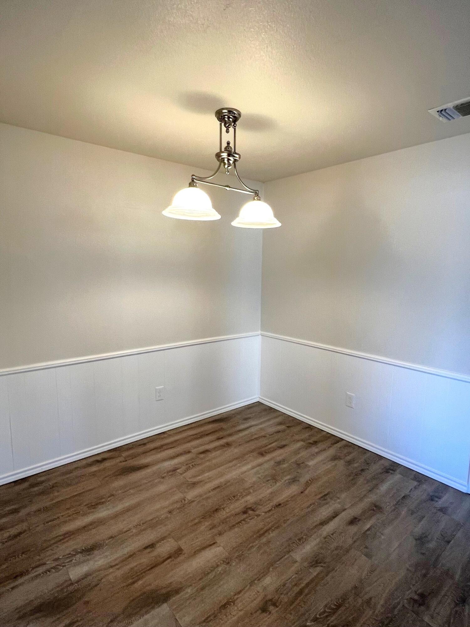 7504 Avenue West, Unit A Lubbock, TX 79423 - Photo 6 of 17 a view of a room with wooden floor