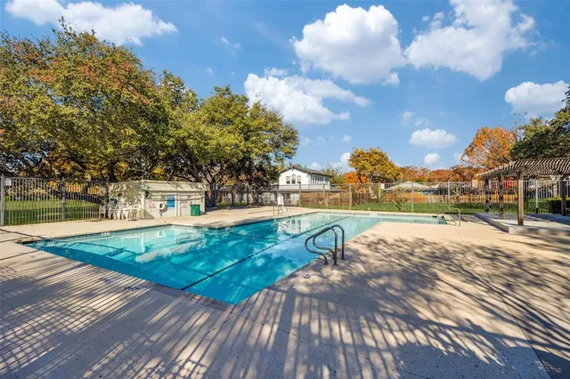 a view of a swimming pool with an outdoor seating