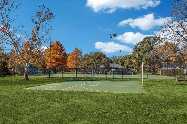 a view of a park with large trees