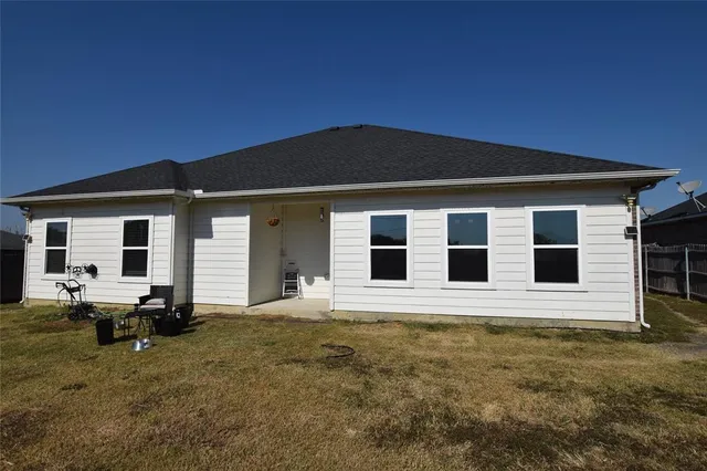 a front view of a house with yard
