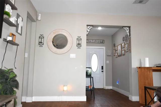 a view of a livingroom with furniture and wooden floor
