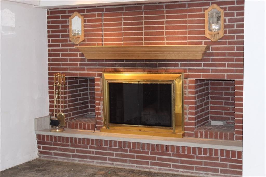 471 County Road Slickville, PA 15684 - Photo 17 of 25 Log burning fireplace in basement; can you picture your holiday tree down here?