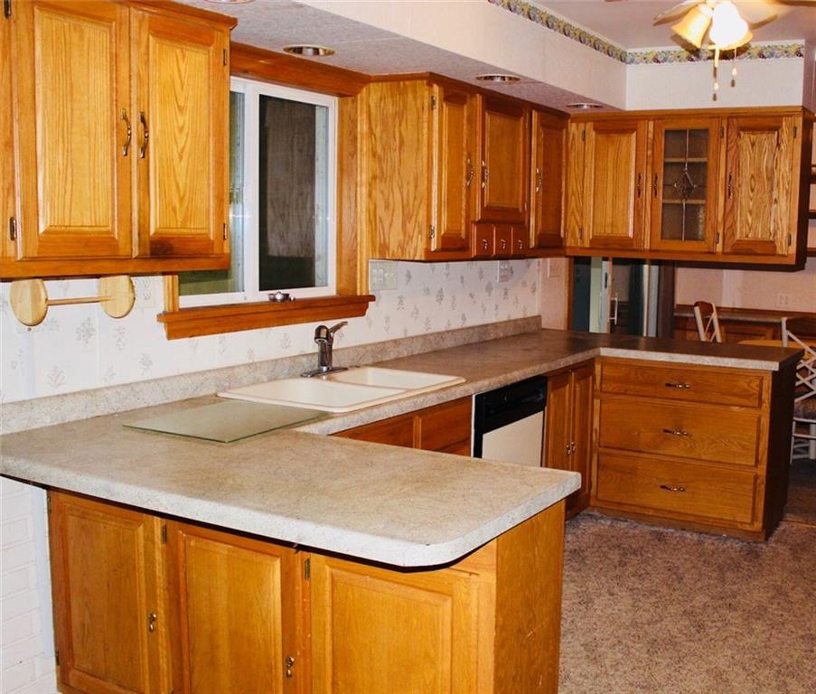 471 County Road Slickville, PA 15684 - Photo 3 of 25 Generous sized kitchen with eating area on one side and adjoins to dining room on the other side.