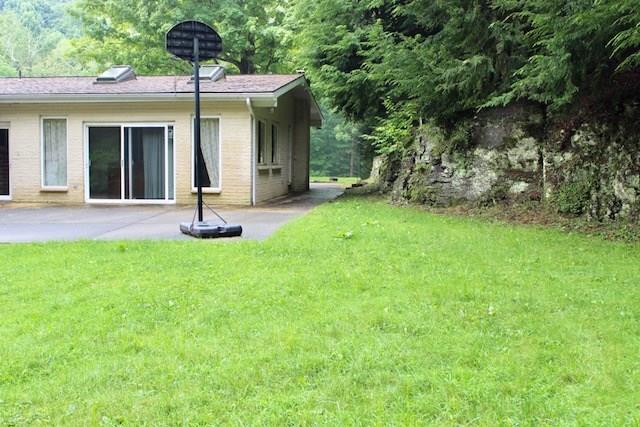 471 County Road Slickville, PA 15684 - Photo 21 of 25 The other back patio with wrap around sidewalk to the first patio.