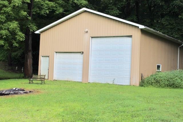 471 County Road Slickville, PA 15684 - Photo 24 of 25 Front view of the outbuilding. The tall bay is big enough to put your rv/camper inside. Otherwise; plenty of space for several vehicles.