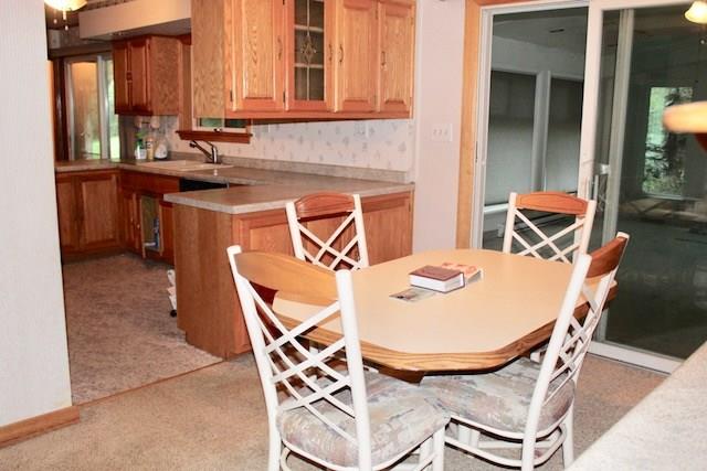 471 County Road Slickville, PA 15684 - Photo 6 of 25 Another view from the dining room into the kitchen and into the family room.