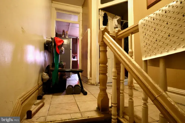 a kitchen with refrigerator and cabinets