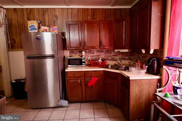 a living room with furniture and a mirror