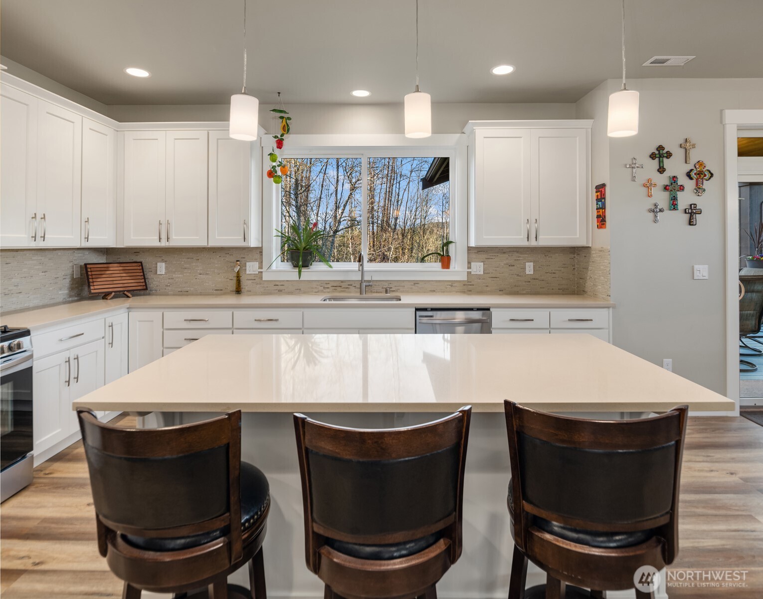 20927 60th Street Southeast Snohomish, WA 98290 - Photo 12 of 40 a large kitchen with a dining table and chairs