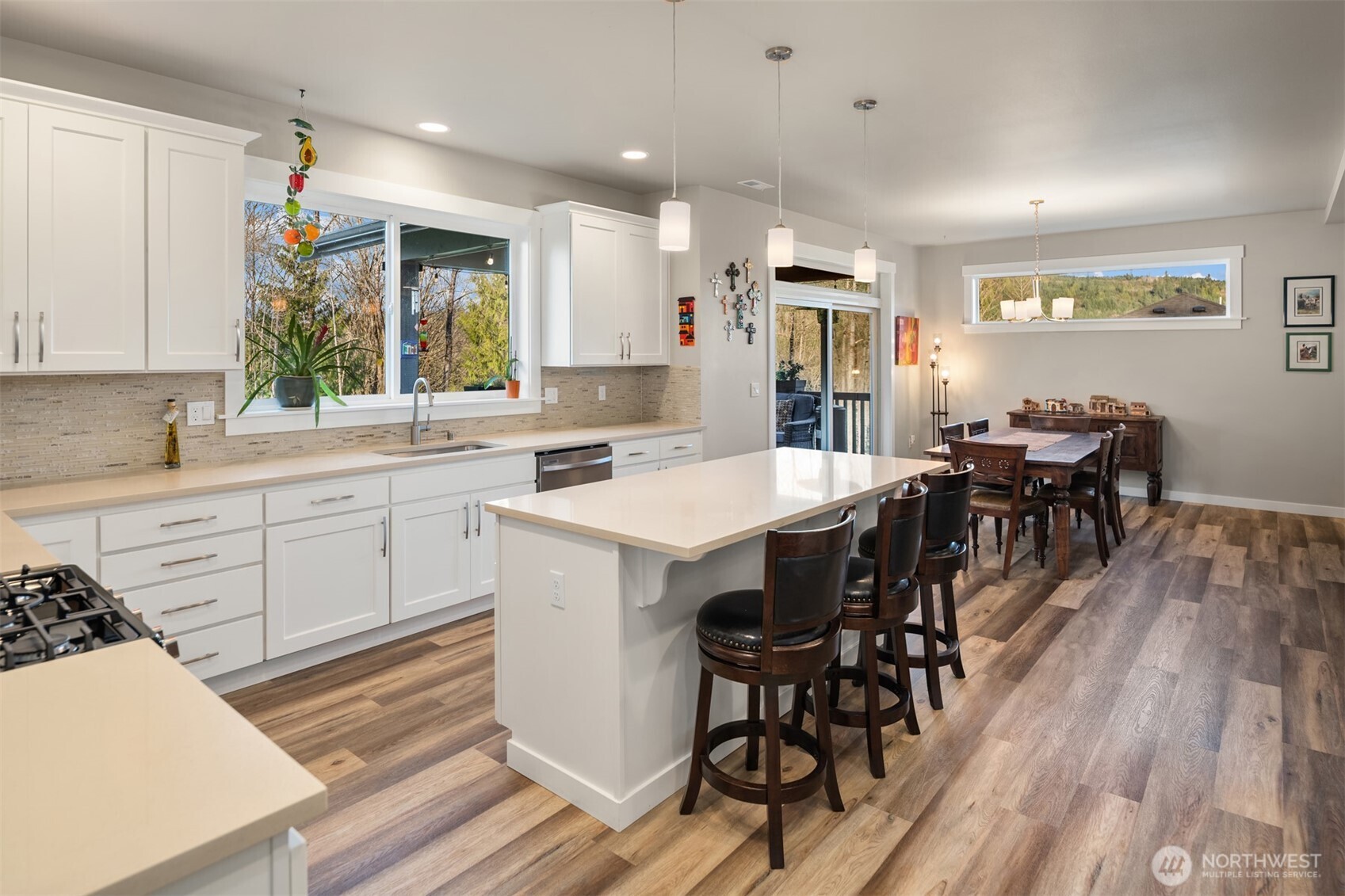 20927 60th Street Southeast Snohomish, WA 98290 - Photo 13 of 40 a kitchen with a table chairs sink and cabinets