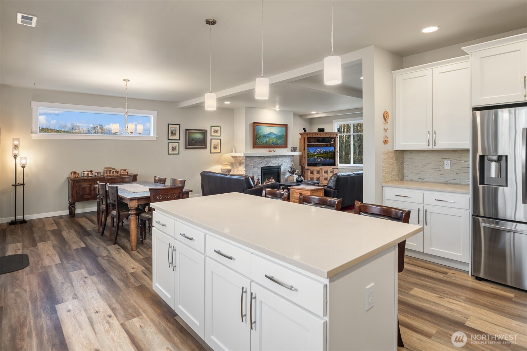 20927 60th Street Southeast Snohomish, WA 98290 - Photo 16 of 40 a large kitchen with kitchen island a white cabinets and refrigerator