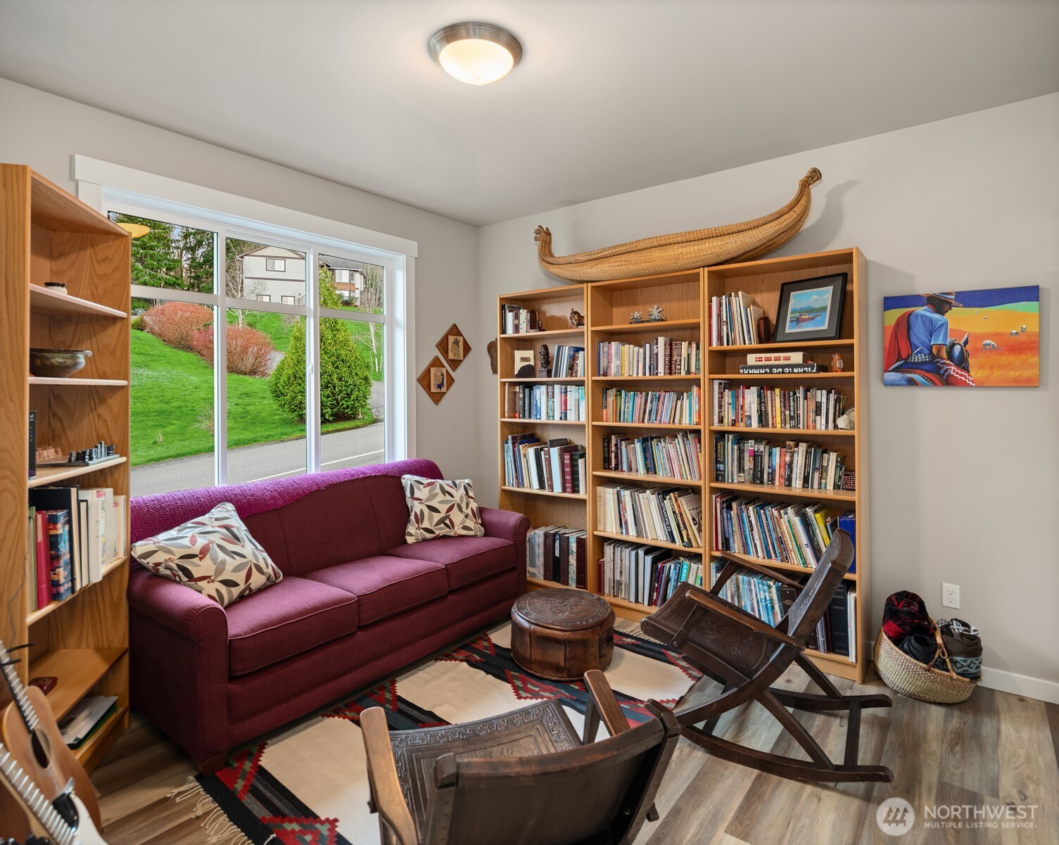 20927 60th Street Southeast Snohomish, WA 98290 - Photo 17 of 40 a living room with furniture a bookshelf and a book shelf
