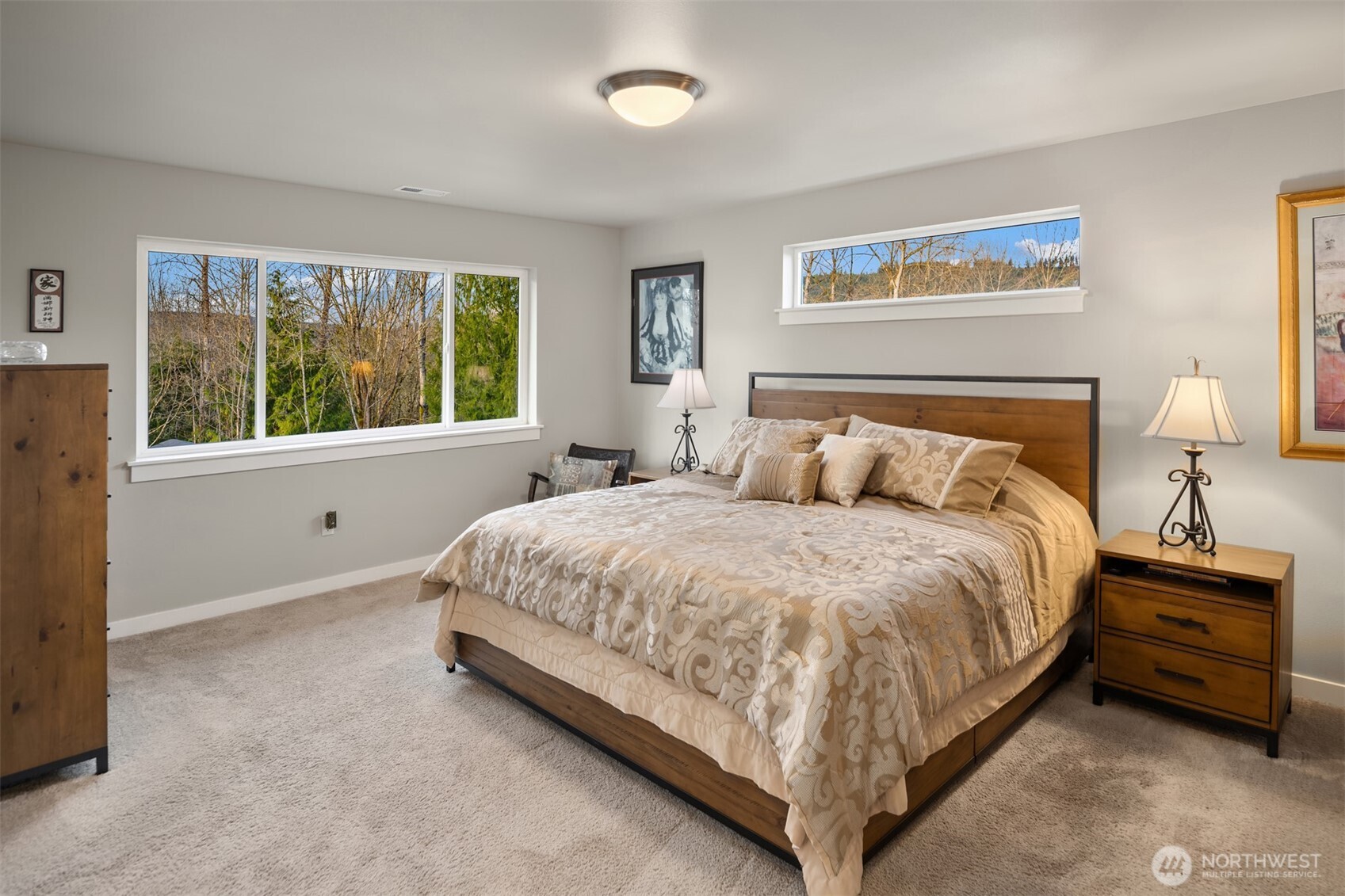 20927 60th Street Southeast Snohomish, WA 98290 - Photo 19 of 40 a large bed sitting in a bedroom next to a window