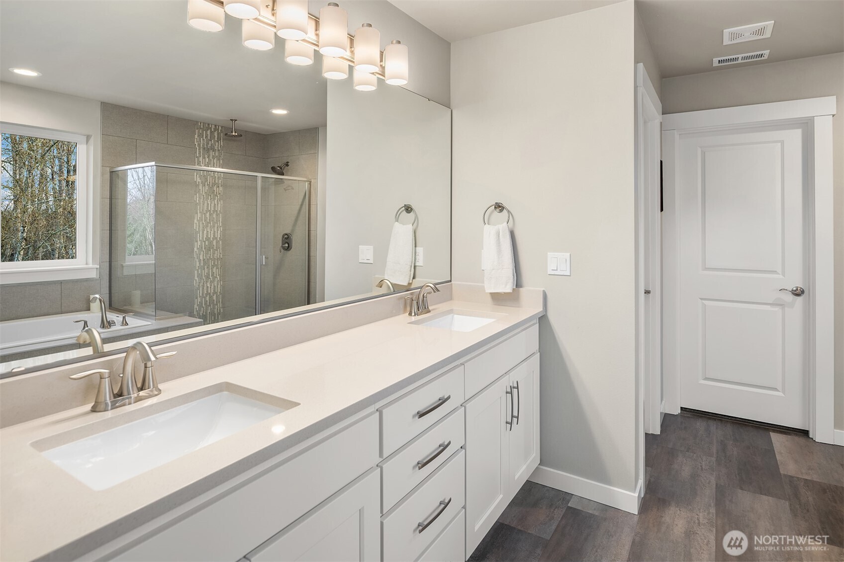 20927 60th Street Southeast Snohomish, WA 98290 - Photo 21 of 40 a bathroom with a sink double vanity and a mirror