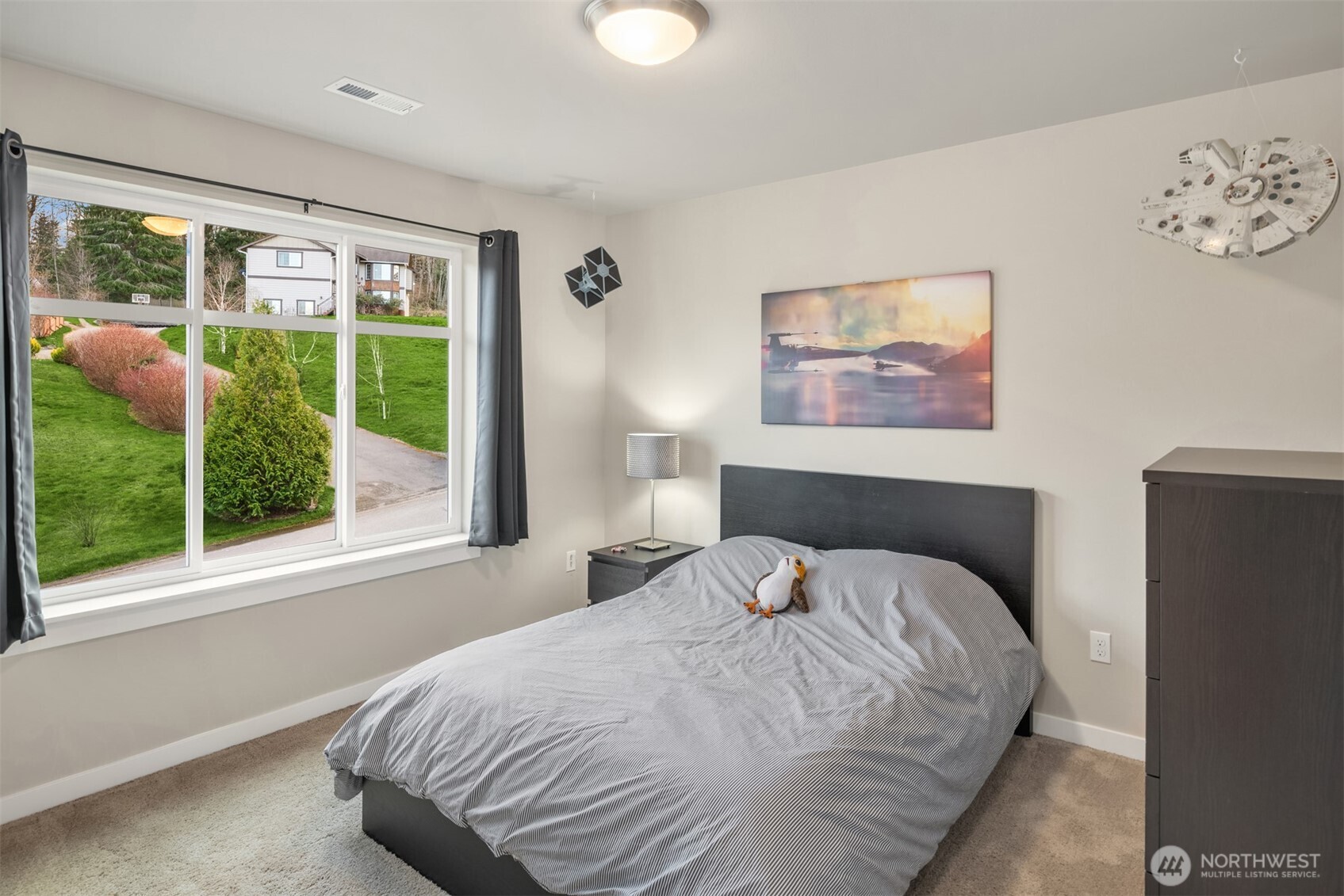 20927 60th Street Southeast Snohomish, WA 98290 - Photo 24 of 40 a bedroom with a bed and a large window
