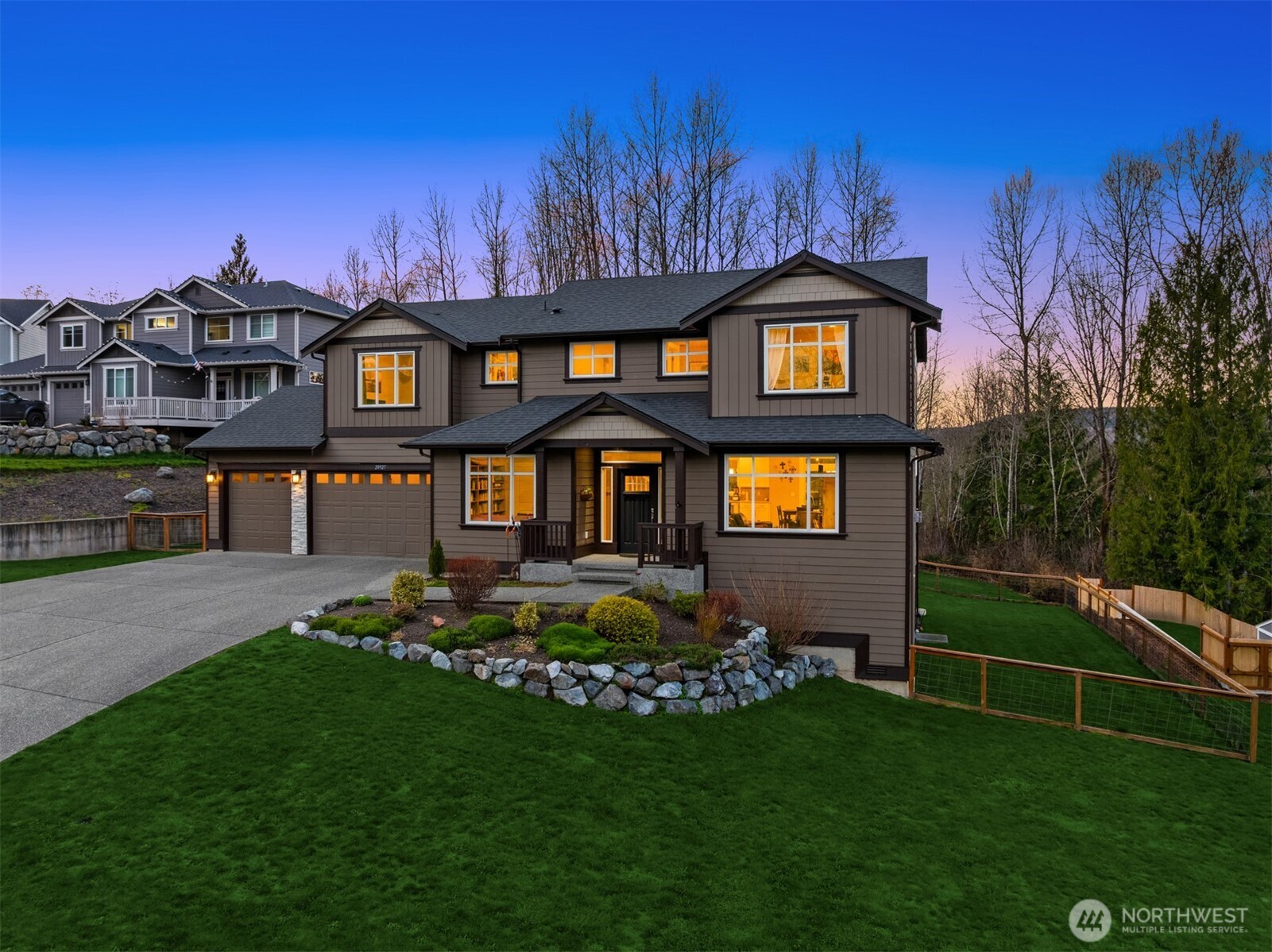 20927 60th Street Southeast Snohomish, WA 98290 - Photo 3 of 40 a front view of a house with a yard