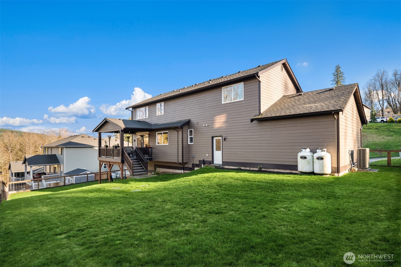20927 60th Street Southeast Snohomish, WA 98290 - Photo 36 of 40 a front view of a house with a garden and yard