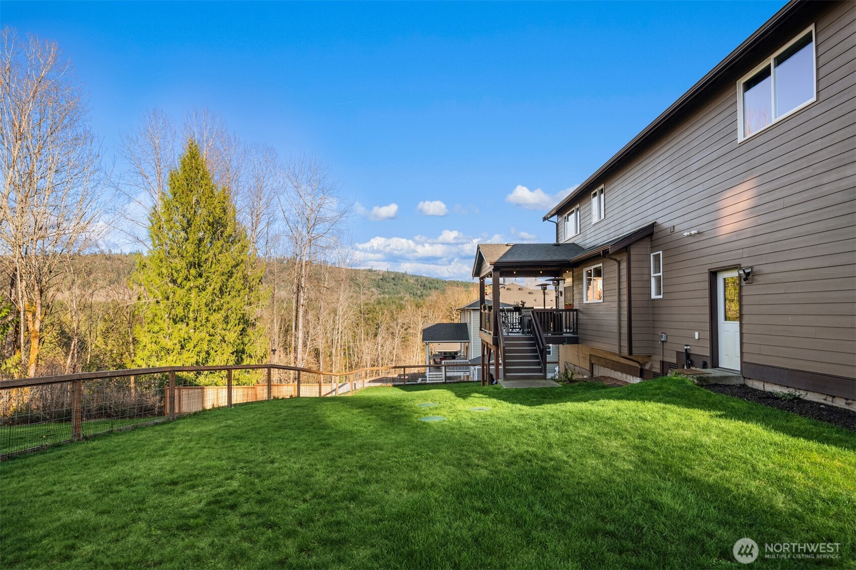 20927 60th Street Southeast Snohomish, WA 98290 - Photo 37 of 40 a view of a house with a yard and sitting area
