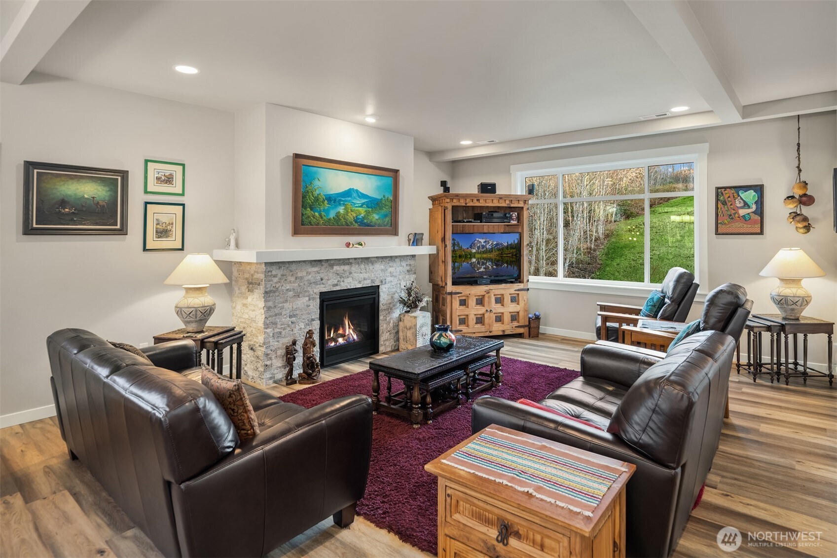 20927 60th Street Southeast Snohomish, WA 98290 - Photo 6 of 40 a living room with furniture a large window and a fireplace