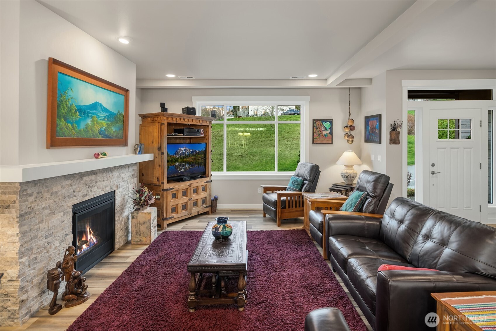 20927 60th Street Southeast Snohomish, WA 98290 - Photo 7 of 40 a living room with furniture and a fireplace