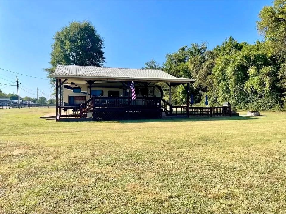 3000 Bridgeview Lane Crump, TN 38327 - Photo 2 of 5 a front view of a building with garden