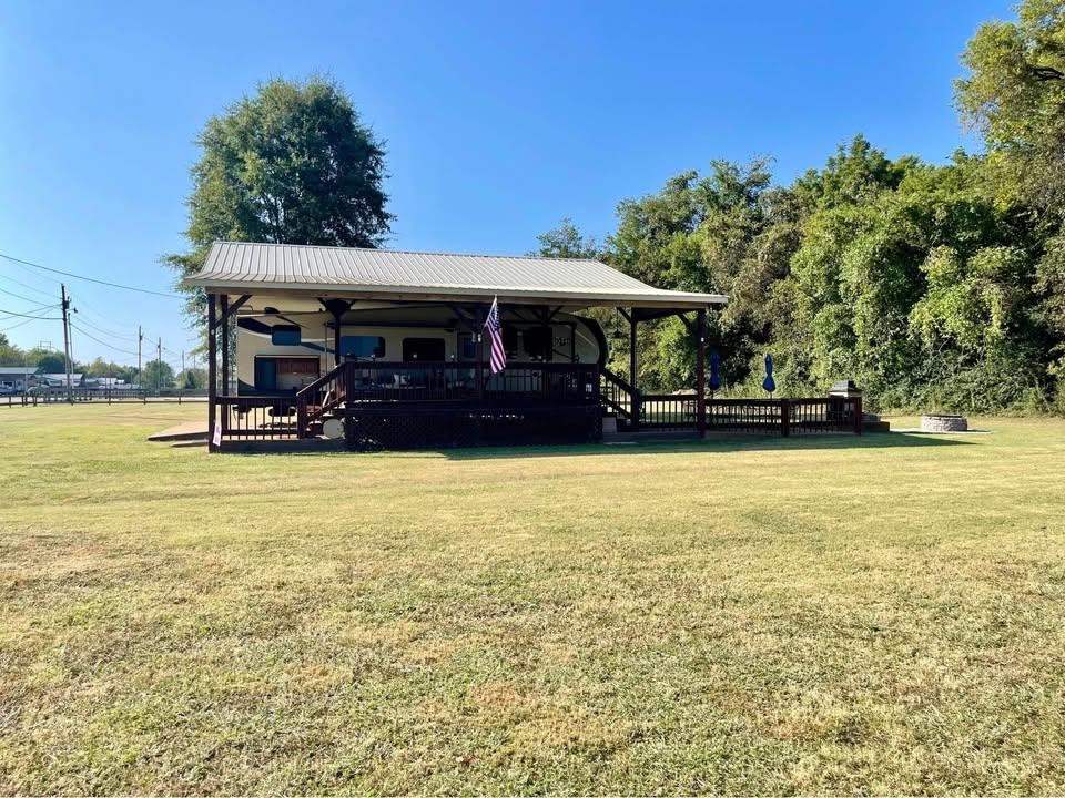 3000 Bridgeview Lane Crump, TN 38327 - Photo 6 of 6 a front view of a building with garden
