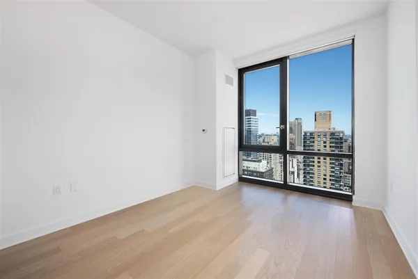 a view of an empty room with glass door