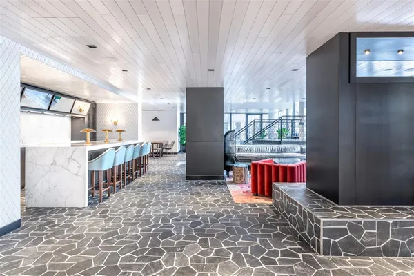 a kitchen with stainless steel appliances granite countertop a refrigerator and a stove