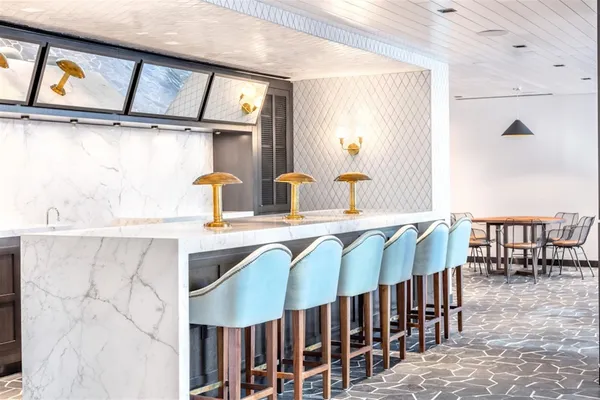 a view of a patio with a table and chairs