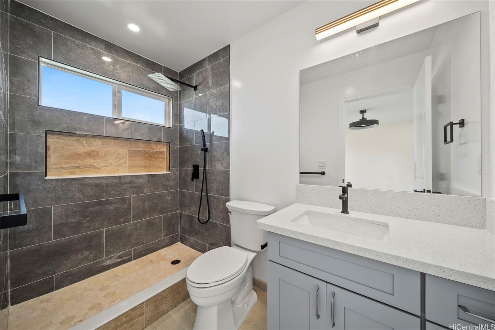 92-792 A Ahikoe Street Kapolei, HI 96707 - Photo 11 of 25 a bathroom with a sink a toilet and shower