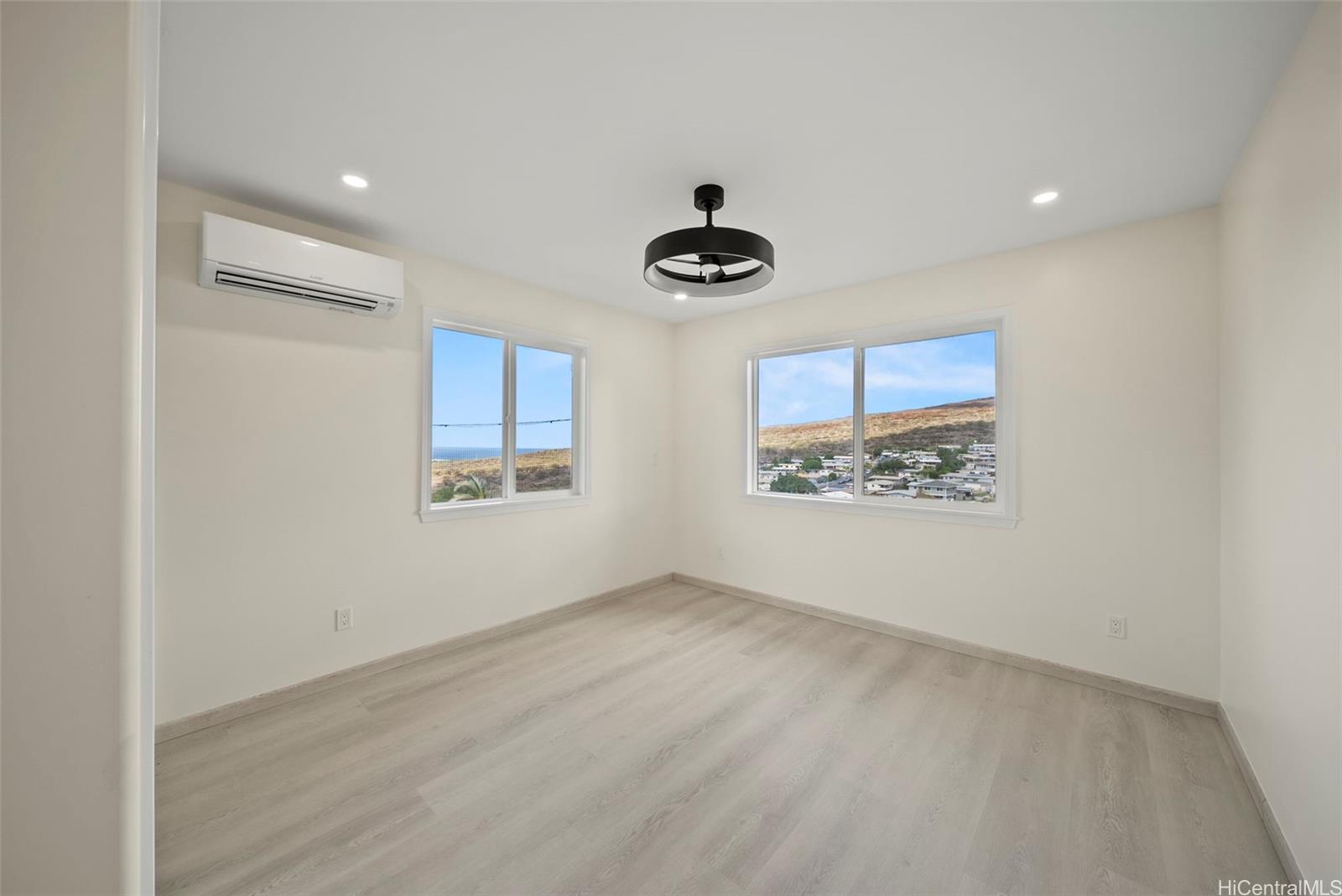 92-792 A Ahikoe Street Kapolei, HI 96707 - Photo 12 of 25 an empty room with windows and fan