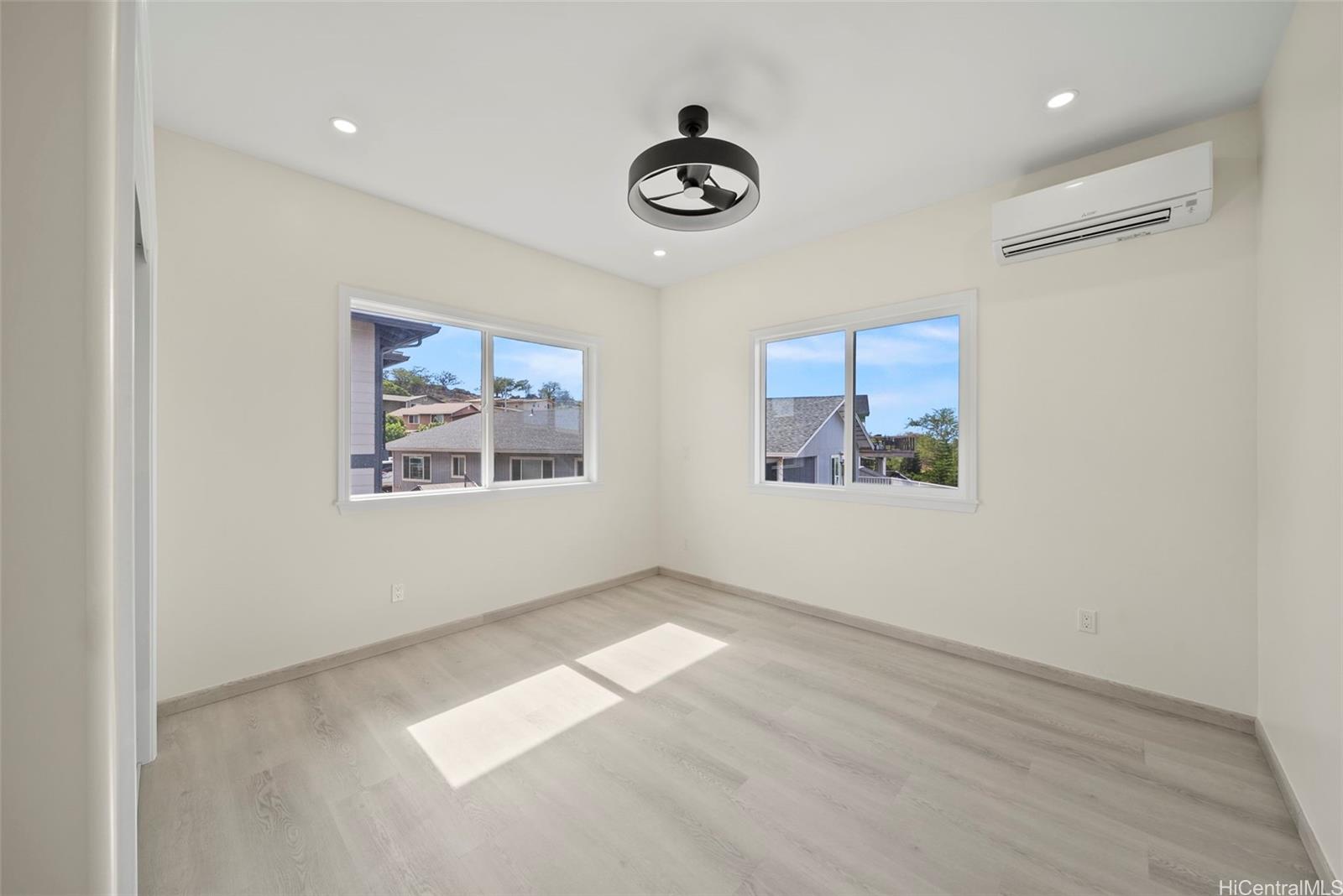92-792 A Ahikoe Street Kapolei, HI 96707 - Photo 18 of 25 an empty room with windows and ceiling fan