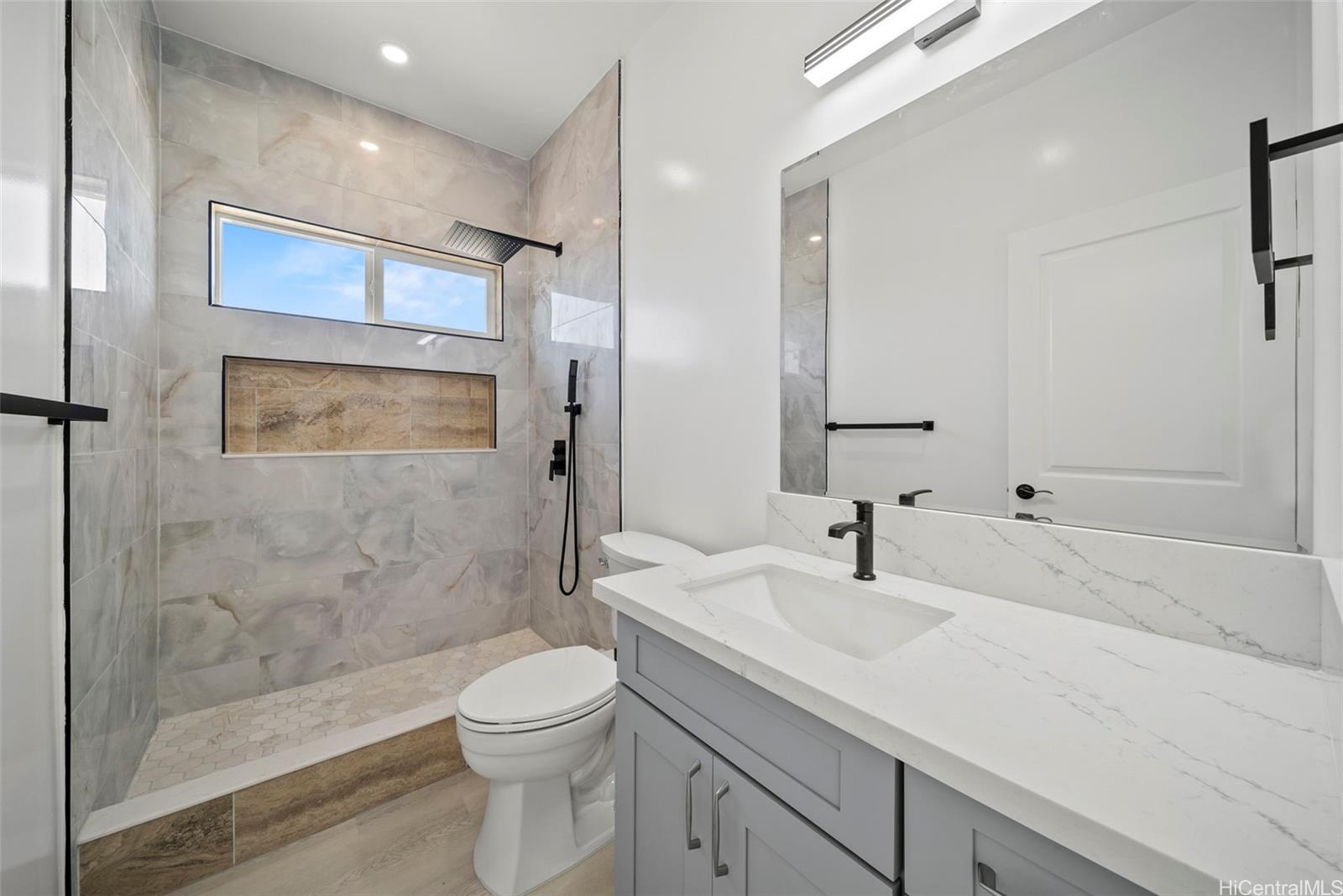 92-792 A Ahikoe Street Kapolei, HI 96707 - Photo 20 of 25 a bathroom with a sink a toilet and shower