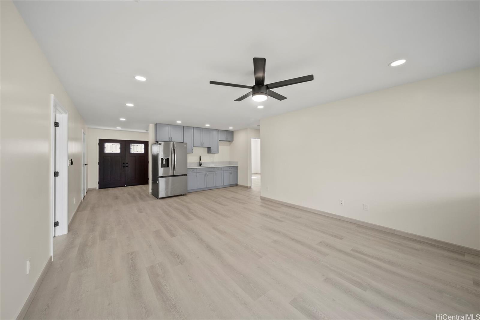 92-792 A Ahikoe Street Kapolei, HI 96707 - Photo 21 of 25 a view of a kitchen with a sink and a refrigerator