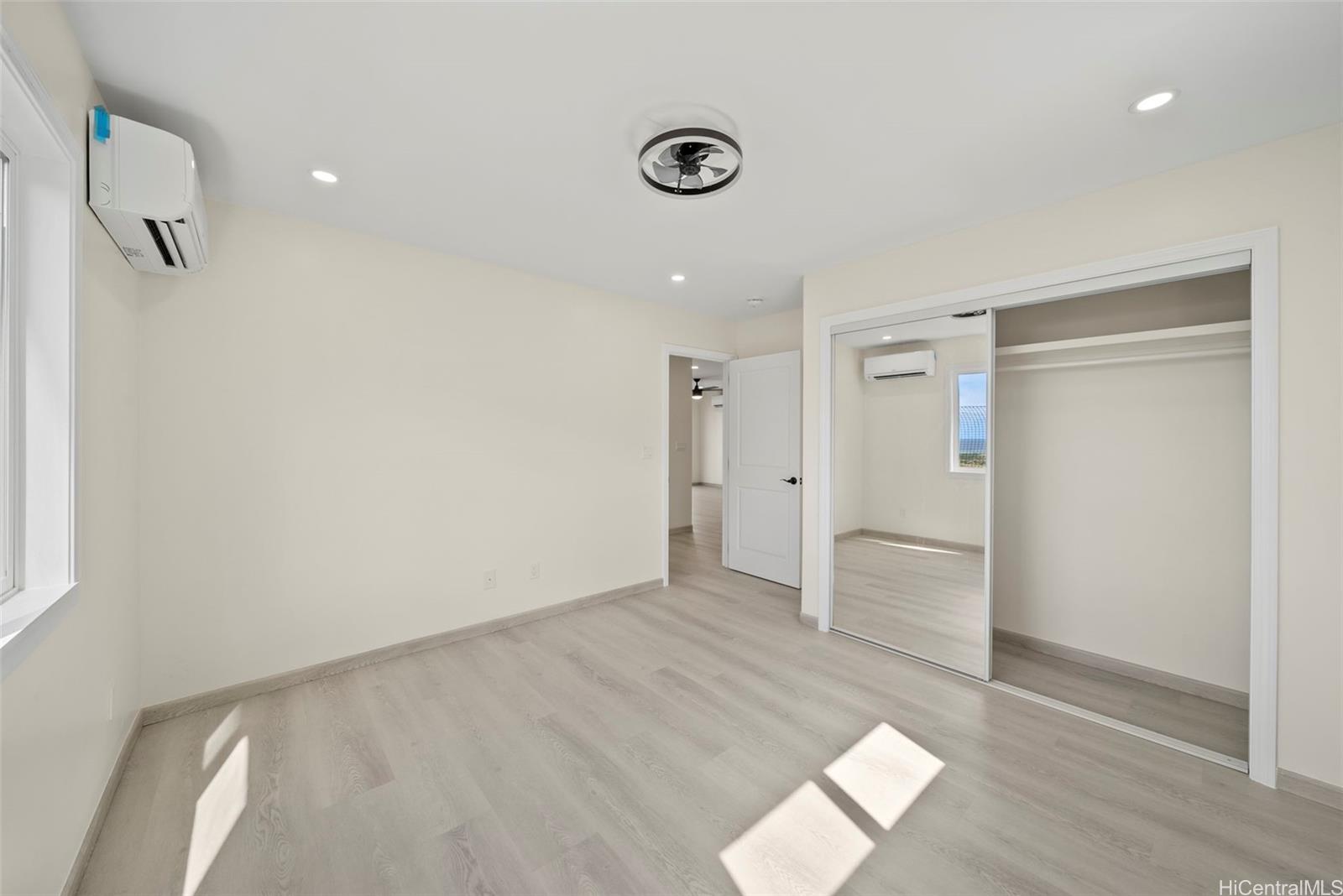 92-792 A Ahikoe Street Kapolei, HI 96707 - Photo 24 of 25 wooden floor in an empty room with a window