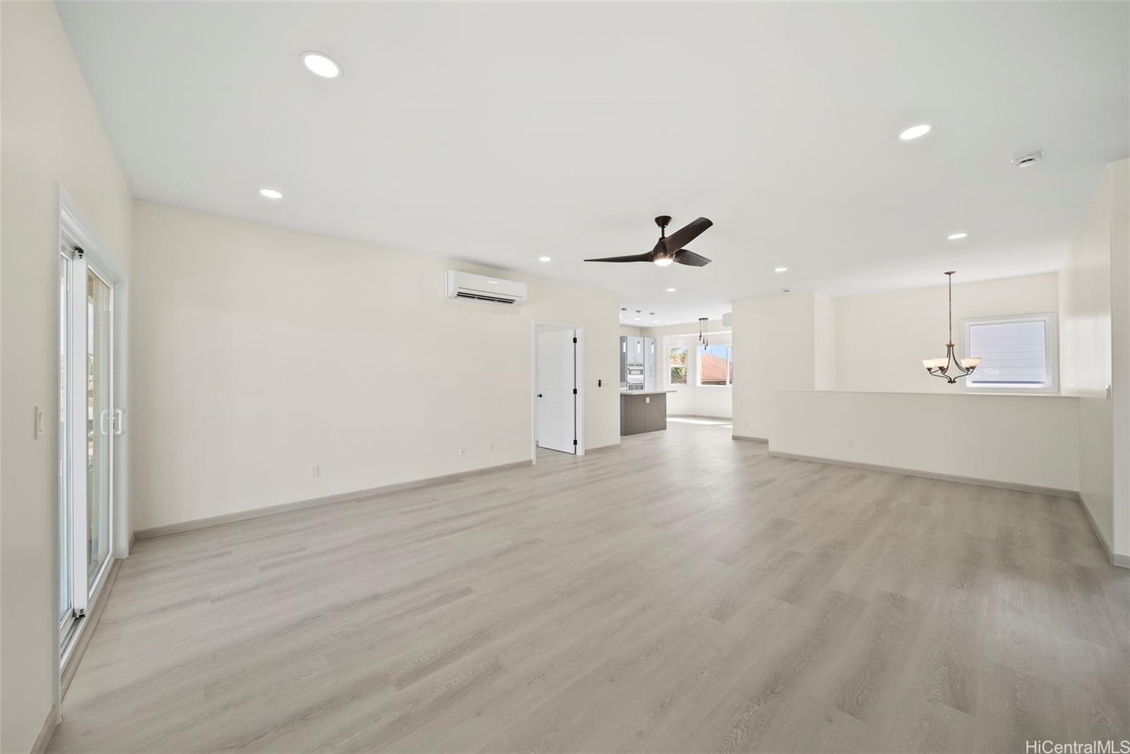 92-792 A Ahikoe Street Kapolei, HI 96707 - Photo 7 of 25 an empty room with wooden cabinet wooden cabinet and windows